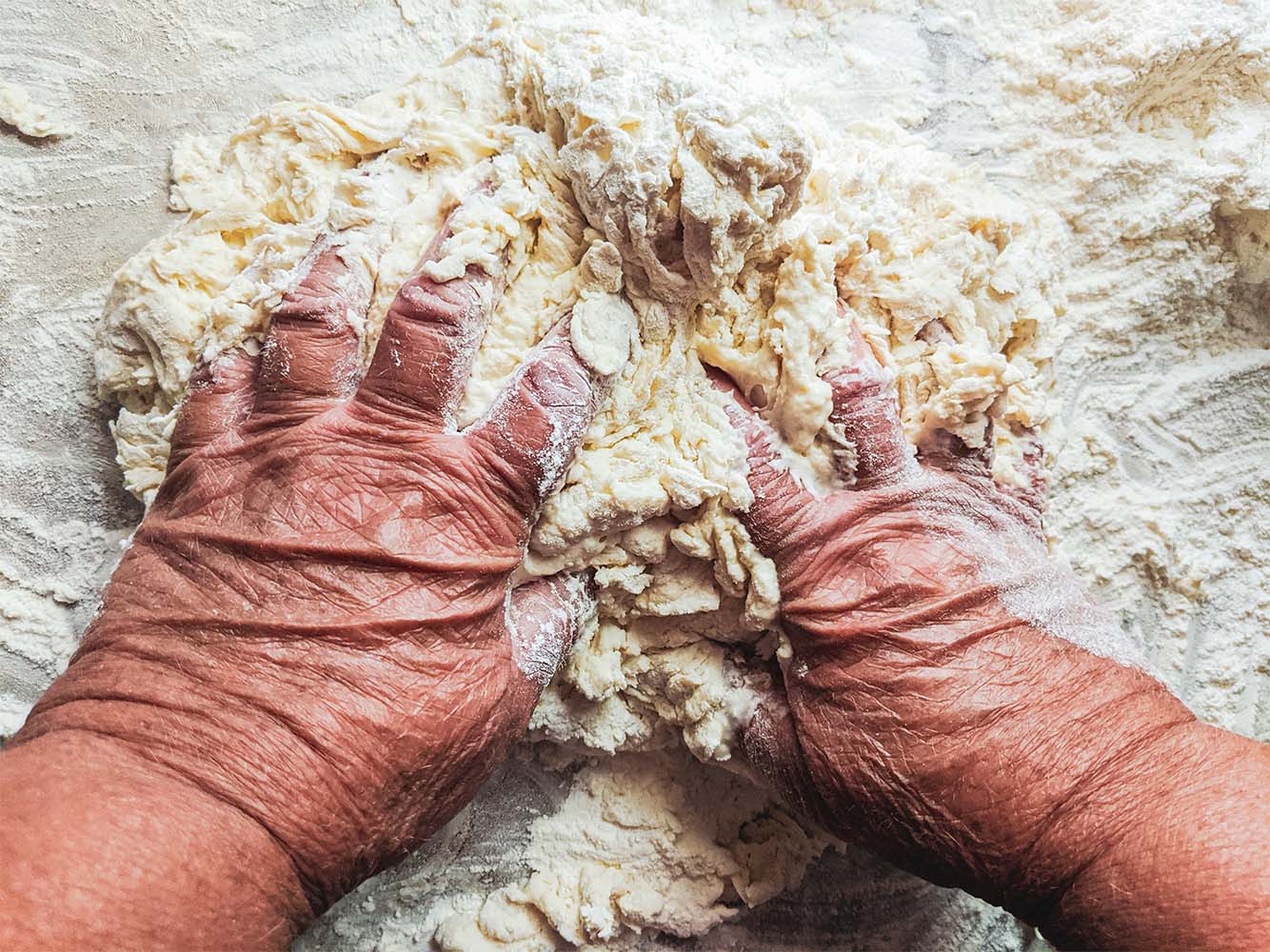 Elderly Hands Kneading Dough