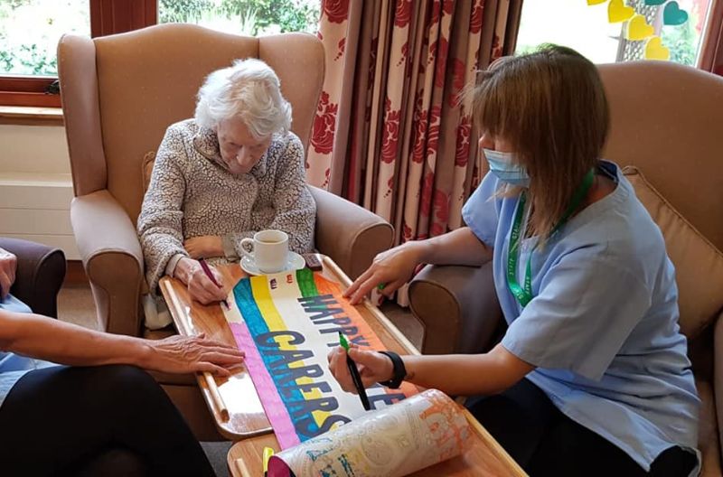 Residents & Staff Painting Banner