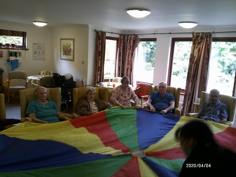 Residents Playing Parachute Game