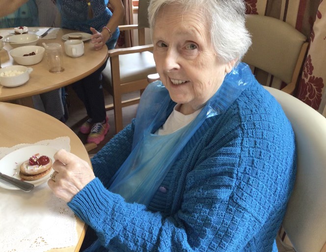 Resident with baked sweet treat