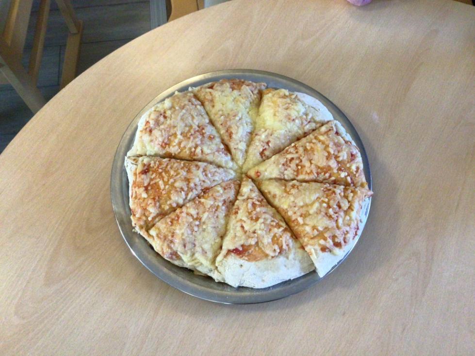 pizza with cheese on top