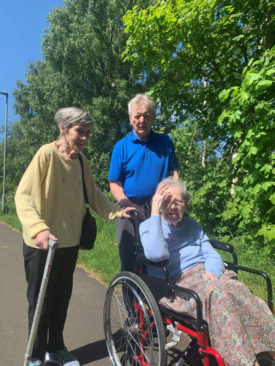 residents on a walk in the sun